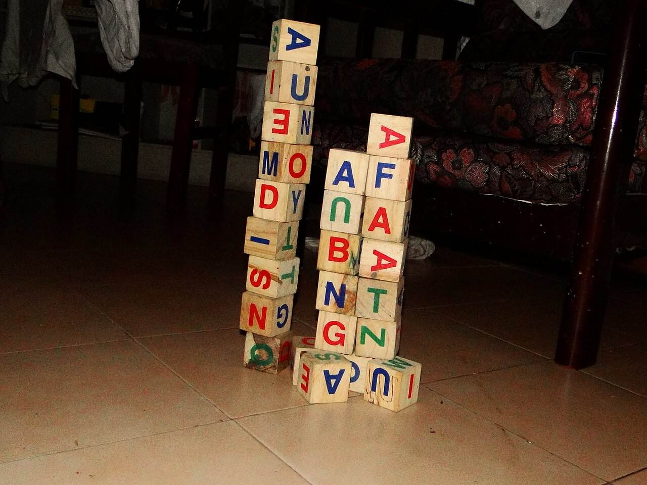 A stack of wooden alphabet blocks