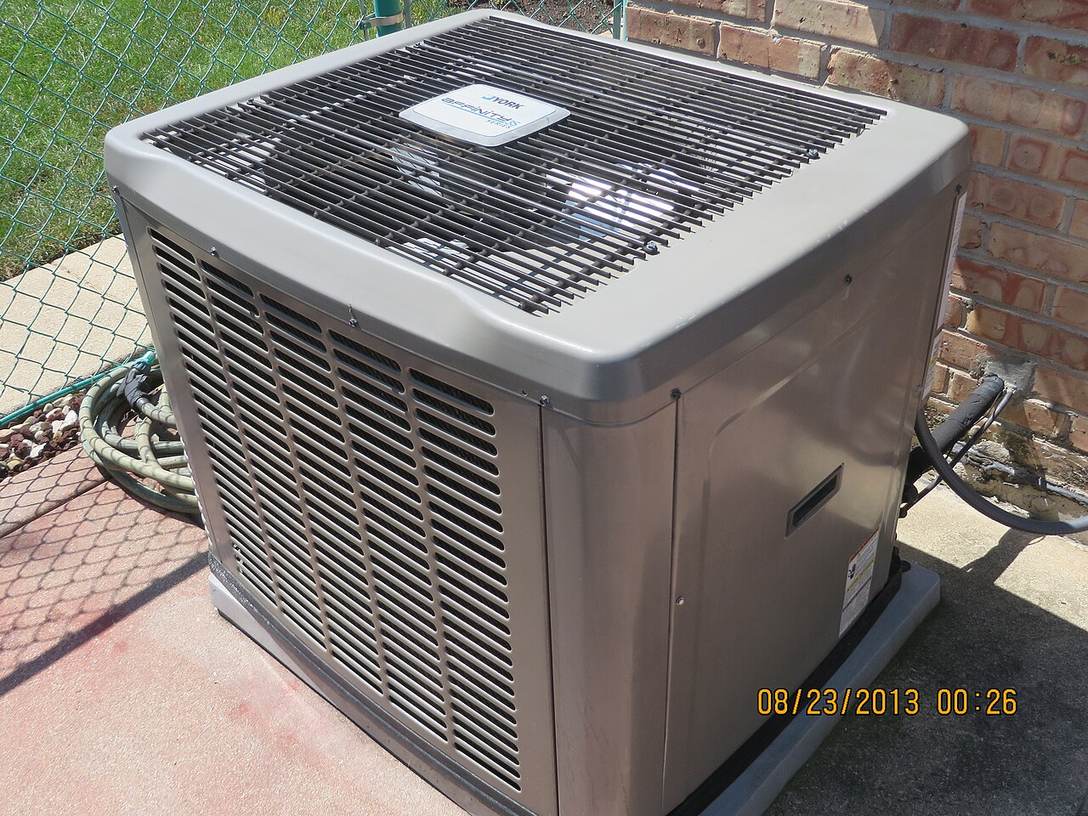 An outdoor central air conditioning condenser unit