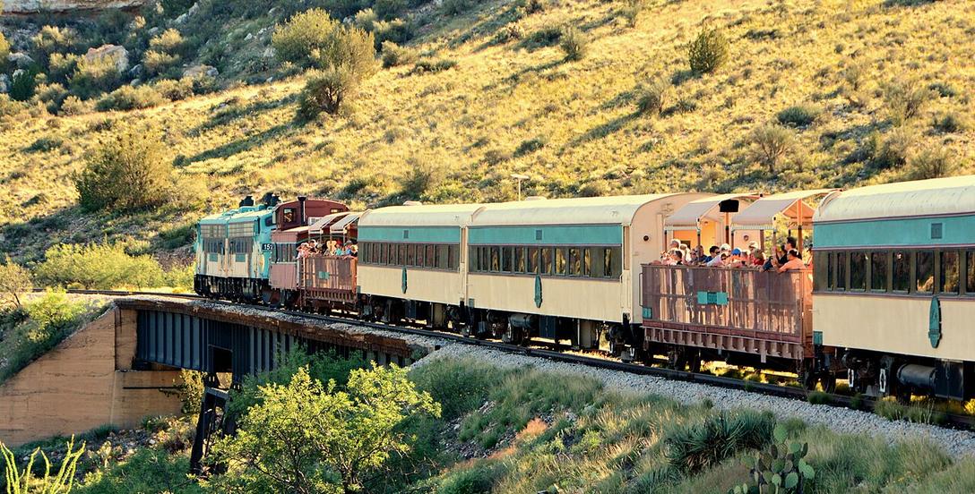 A passenger train crossing a trestle in the Verde Canyon