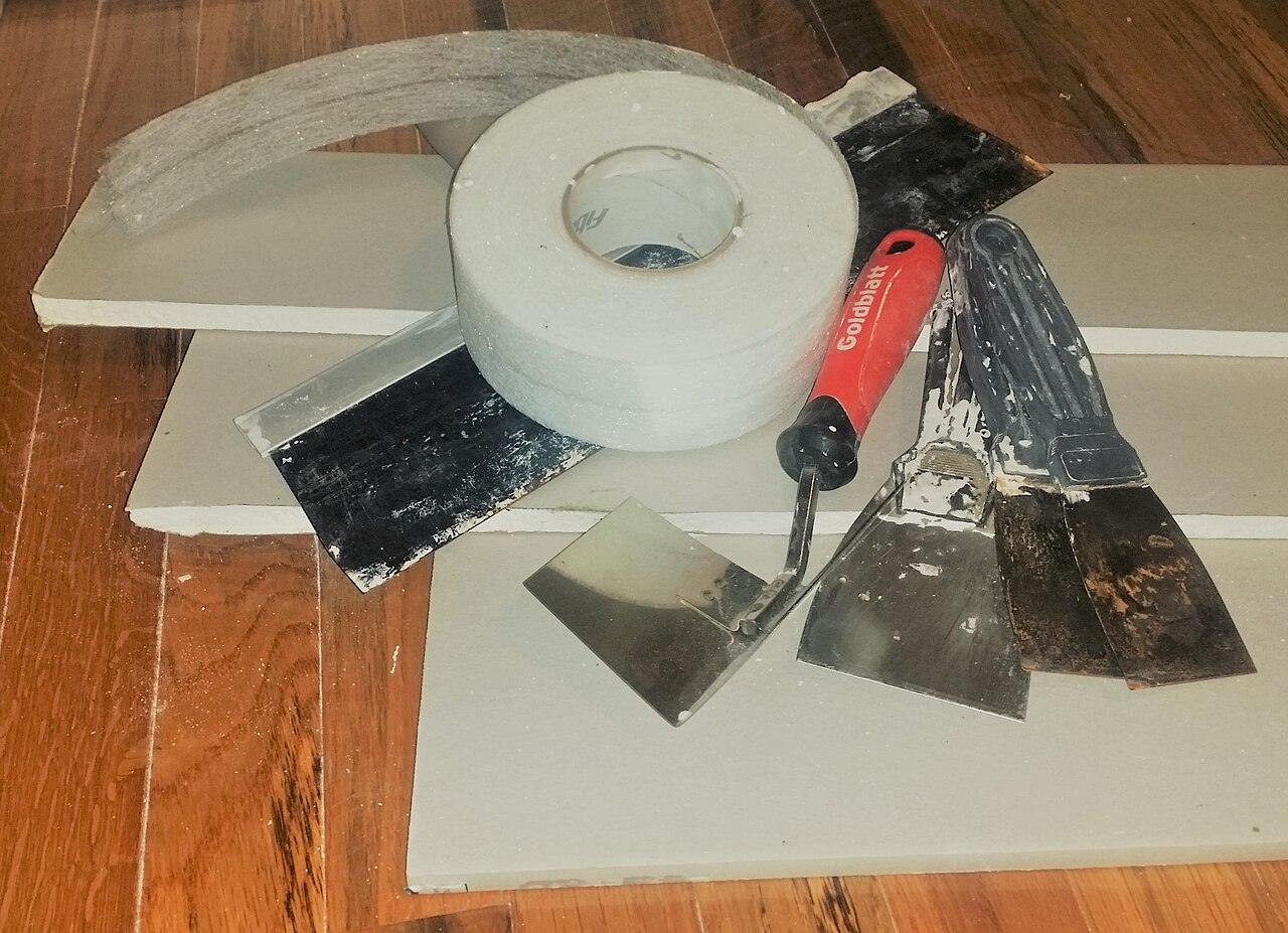 Drywall sheets with tape and finishing knives