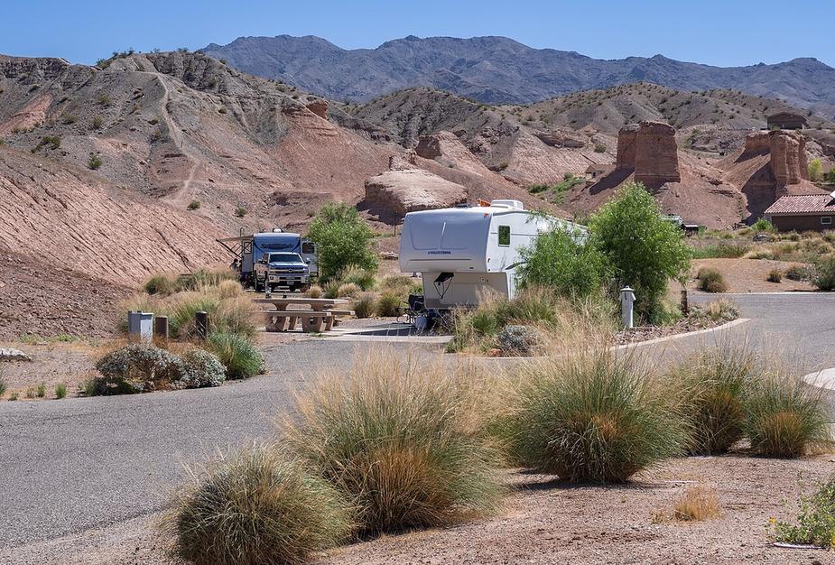 Travel trailers parked at a desert RV campground
