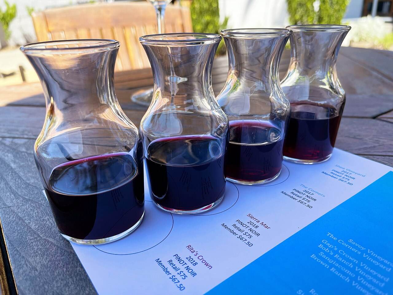 Small carafes of red wine set out for a tasting